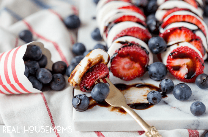 Red, white, and blue never tasted so good! The juicy berries, fresh mozzarella cheese, and balsamic reduction's sweet, syrupy goodness in this BERRY CAPRESE will have everyone coming back for more!
