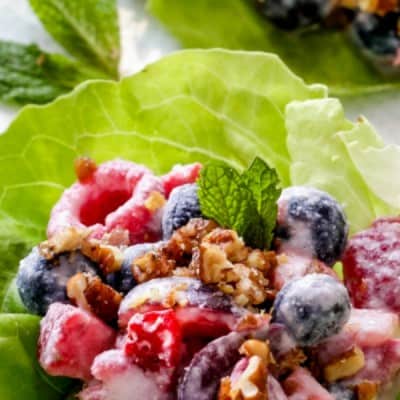 BERRY SALAD FRUIT LETTUCE WRAPS are one of the BEST ways to eat fruit salad! This dish tastes indulgently gourmet but takes minutes to whip up!