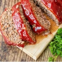 classic meatloaf sliced on a cutting board