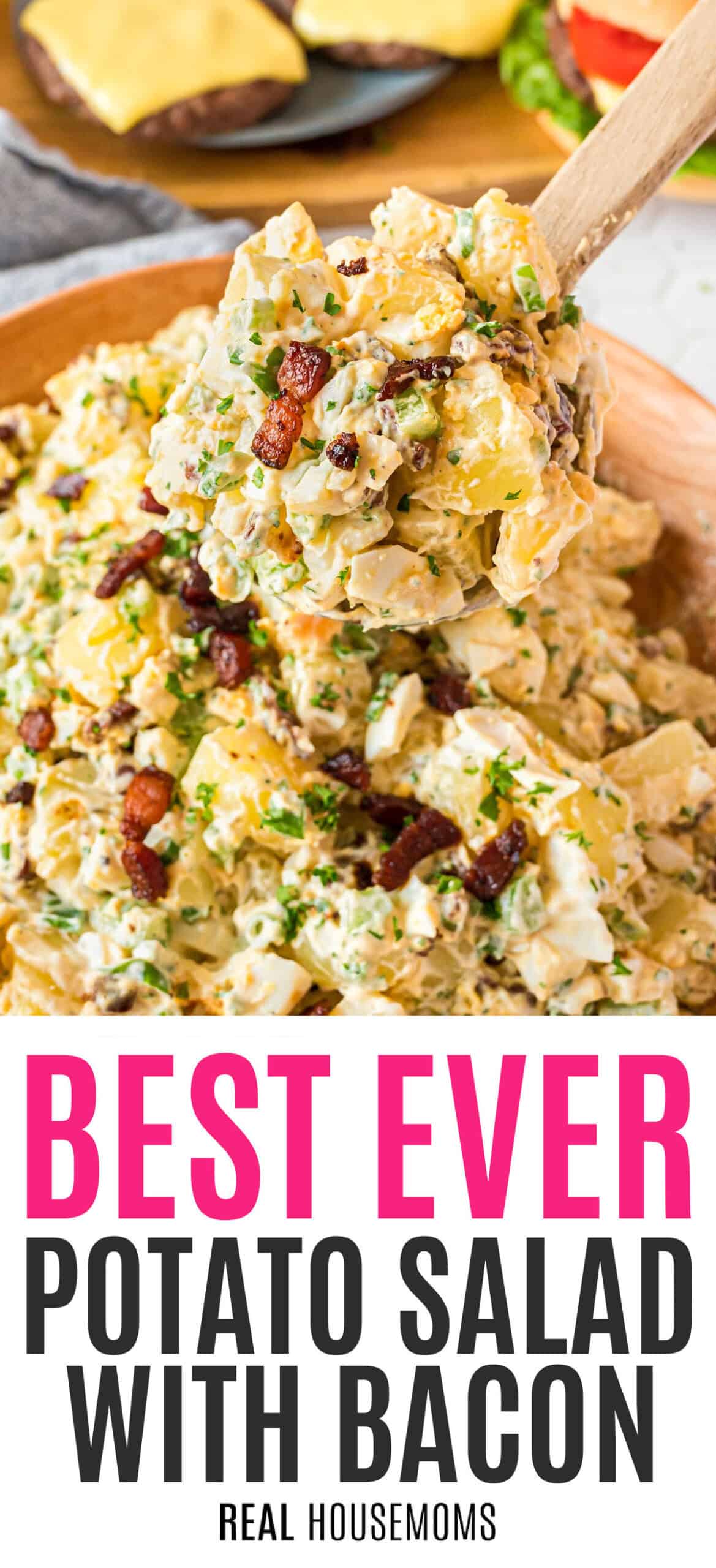 potato salad with bacon in a serving bowl with recipe name at the bottom