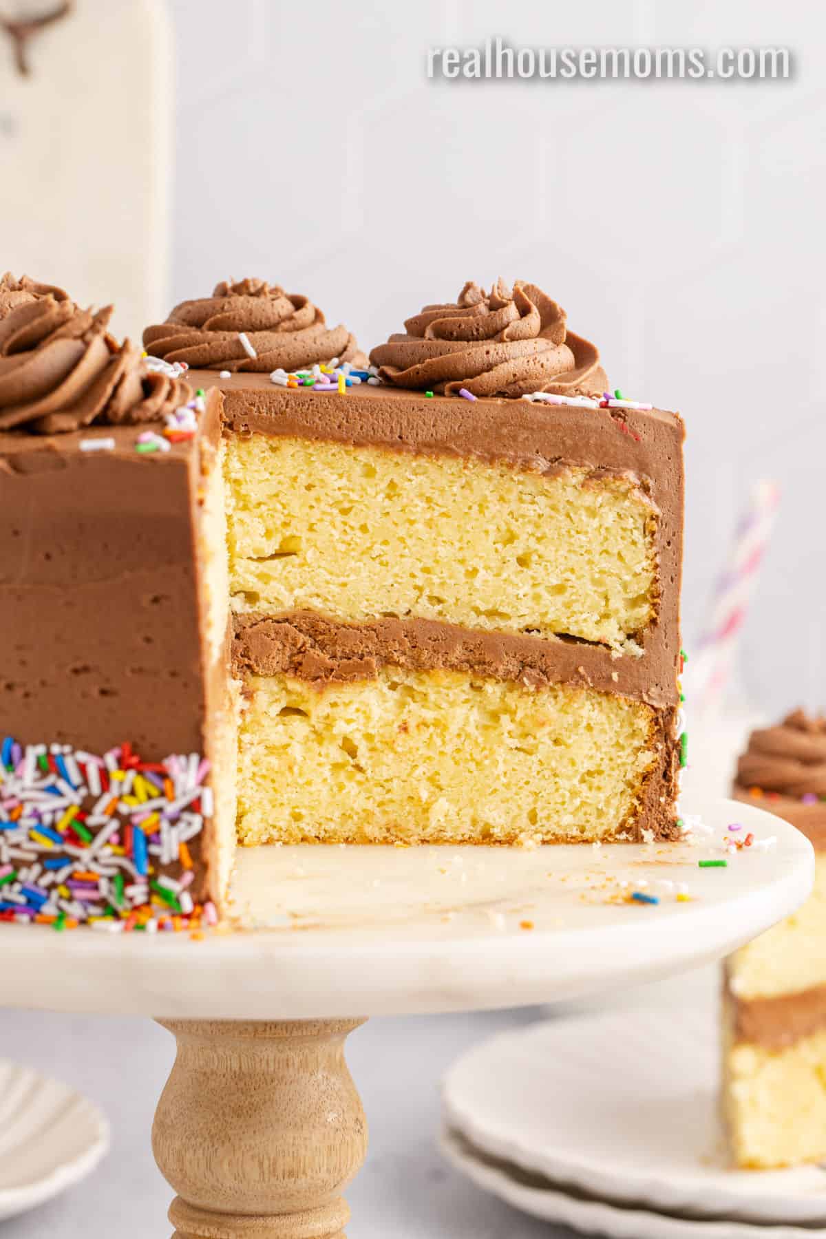 birthday cake with a portion taken out to show the layers inside