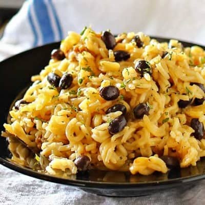 Black Bean Pilaf is simmered in bouillon seasoning & broth & loaded with black beans. You won't believe how easy it is to make this old family recipe that everyone LOVES. No more need for a box!