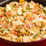 square image of blackened shrimp & lobster pasta in a pot