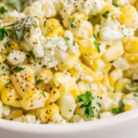 close up of blue cheese corn salad in a bowl with recipe name at bottom