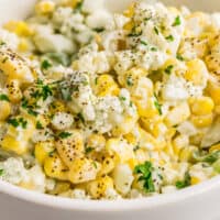 square close up image of blue cheese corn salad in a bowl