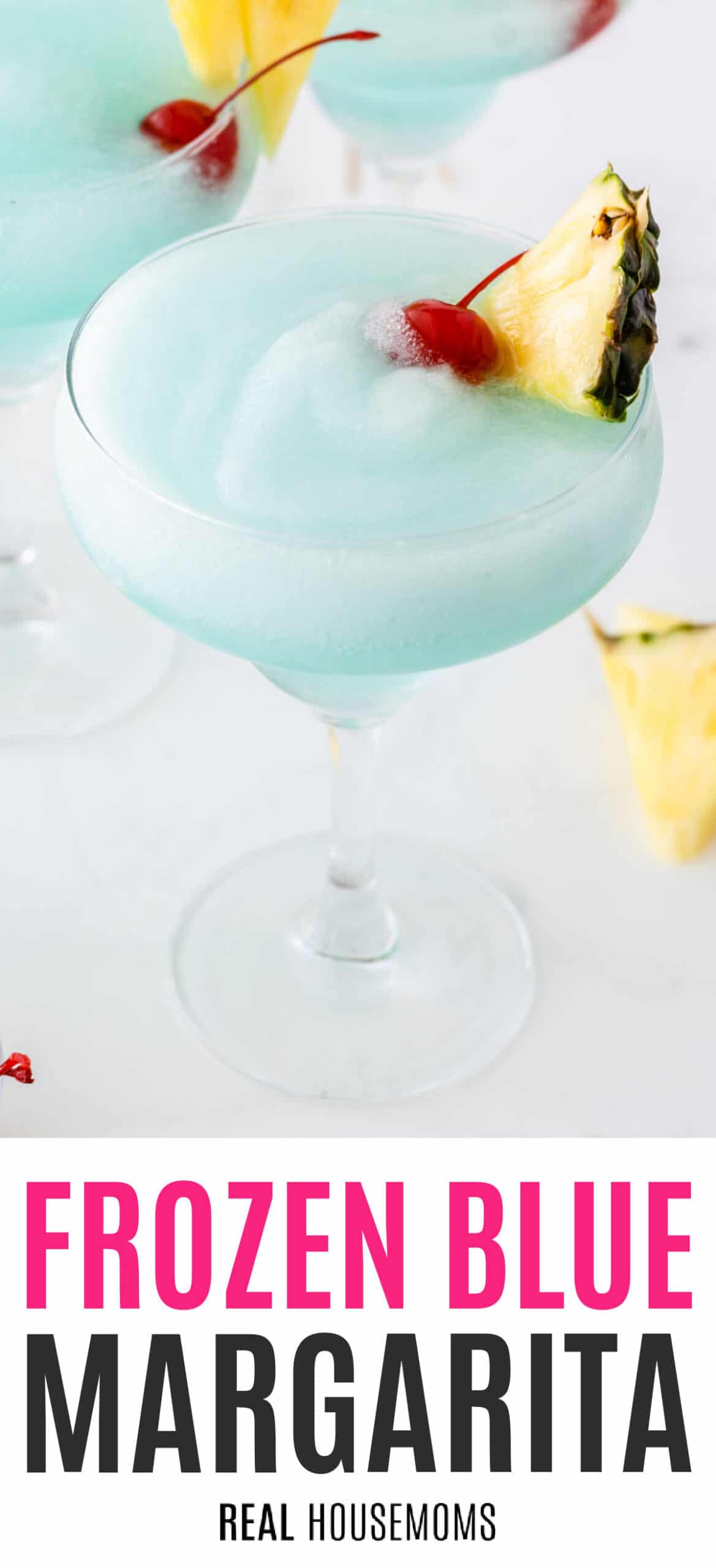 blue margarita in a margarita glass garnished with cherry and pineapple with recipe name at the bottom