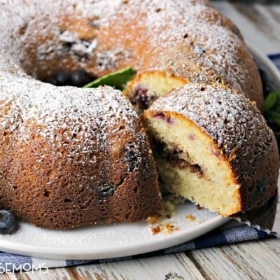 BLUEBERRY BUTTERMILK COFFEE CAKE is a delightfully moist cake bursting with fresh blueberries and a cinnamon pecan filling! You'll want to bake one up immediately to go with your next cup of coffee!