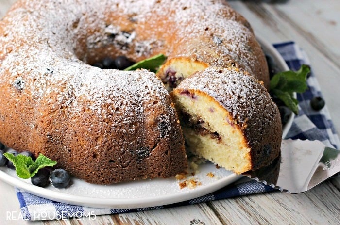 BLUEBERRY BUTTERMILK COFFEE CAKE is a delightfully moist cake bursting with fresh blueberries and a cinnamon pecan filling! You'll want to bake one up immediately to go with your next cup of coffee!