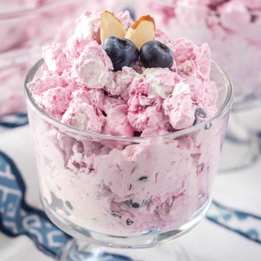 Blueberry Fluff is a tasty dessert perfect for potlucks, cookouts & picnics! It's loaded blueberries & almonds and you can make it ahead of time!