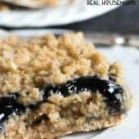 Only 6 ingredients in these Blueberry Oatmeal Bars. Use pie filling to have this recipe turn out more like a cobbler or use jam to have a packable snack!