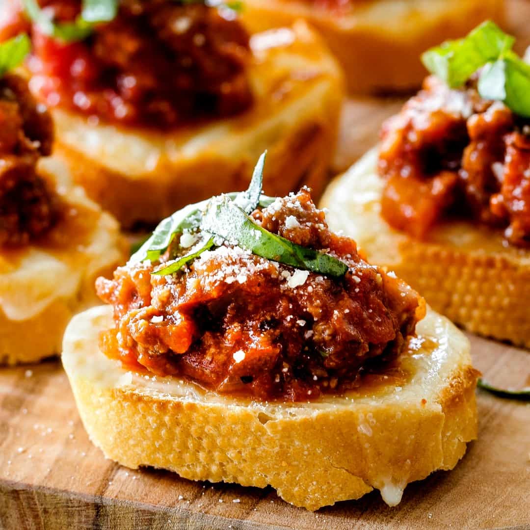 Bolognese Bruschetta is the hearty, comforting winter version of traditional bruschetta that makes an ideal appetizer that will be the hit of every party!