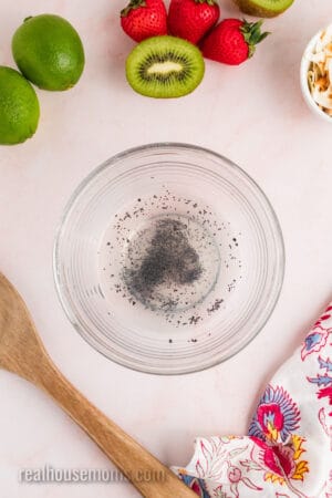 coconut rum, lime juice, and poppy seeds in a small glass bowl