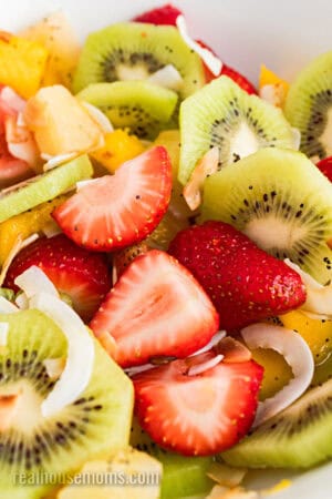 close up of boozy tropical fruit salad in a serving bowl