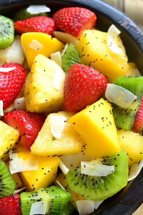 This BOOZY TROPICAL FRUIT SALAD is the perfect addition to your spring or summer menu! Loaded with fresh tropical fruit and swimming in a boozy coconut-lime "dressing", it's sure to become your favorite new way to eat fruit!