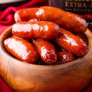 square image of bourbon brown sugar smokies in a wooden bowl
