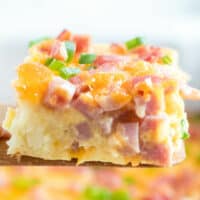 Easy Breakfast Casserole with Ham is cheesy, gooey, and delicious (BONUS - it has tater tots). Your family will be scraping their plates & begging for more!