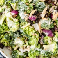 broccoli salad in a serving bowl with recipe name at the bottom