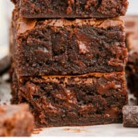 three brownies from scratch stacked with recipe name at the bottom