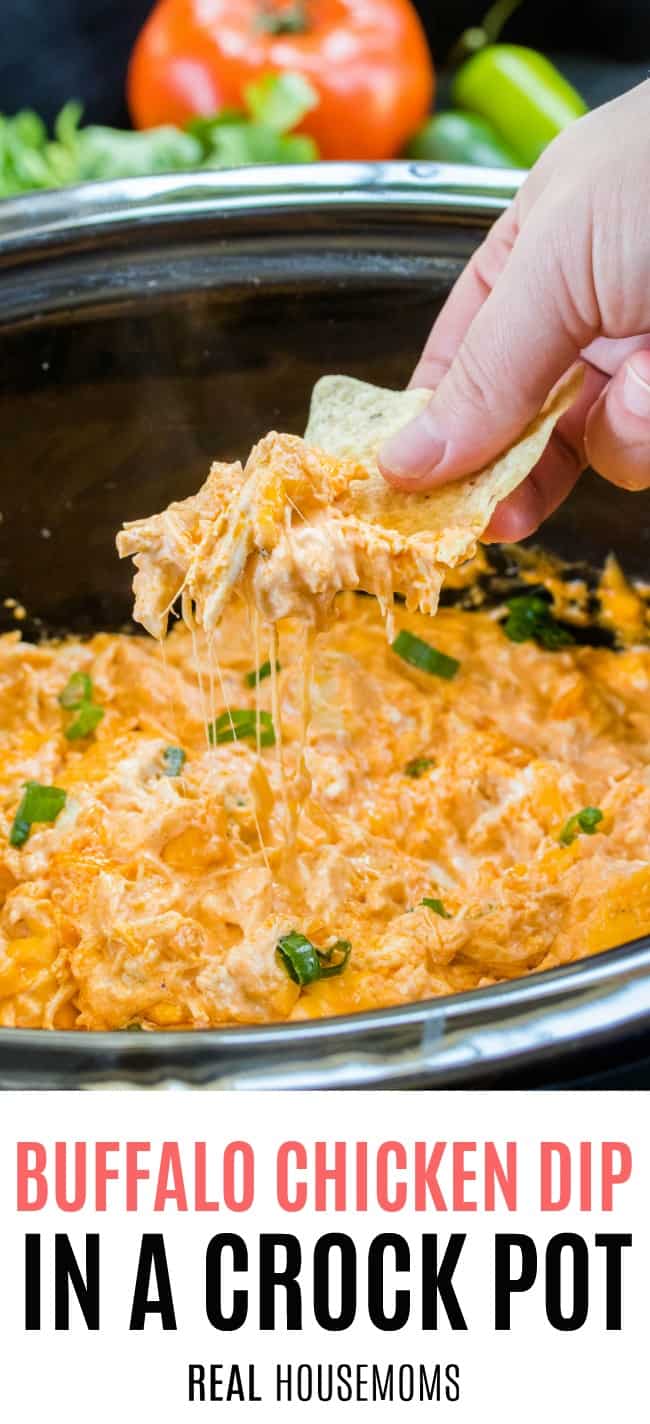 chip loaded with buffalo chicken dip being lifted from crock pot