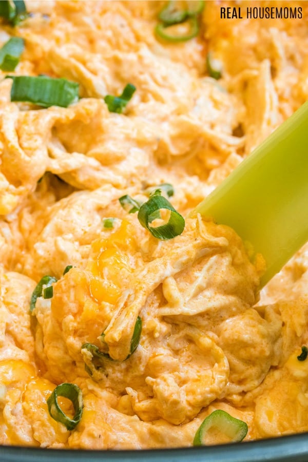 square image of buffalo chicken dip in a crock pot with text