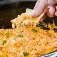 This spicy Buffalo Chicken Dip in a Crock Pot is a creamy mix of cheese, chicken, and spicy buffalo sauce that is the perfect appetizer for parties!
