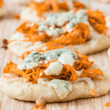 Buffalo Chicken Pizza Bites are a poppable party appetizer that'll have everyone asking for the recipe! Easy to make and great for serving a crowd!