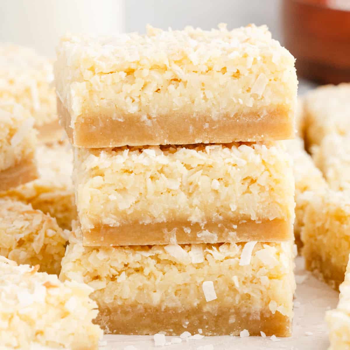 square image of three coconut bars stacked up