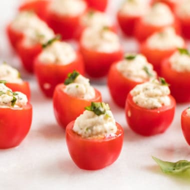 Take these Caprese Tomato Bites to your next potluck & watch them disappear! Juicy tomatoes filled with herbed mozzarella makes it hard to stop at just one!