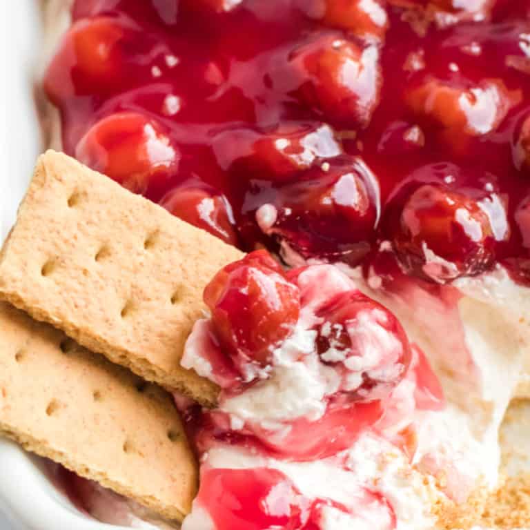 Cherry Cheesecake Dip is the most divine, easy to make dish! It's the ultimate 5-ingredient no bake dessert or appetizer for any party!