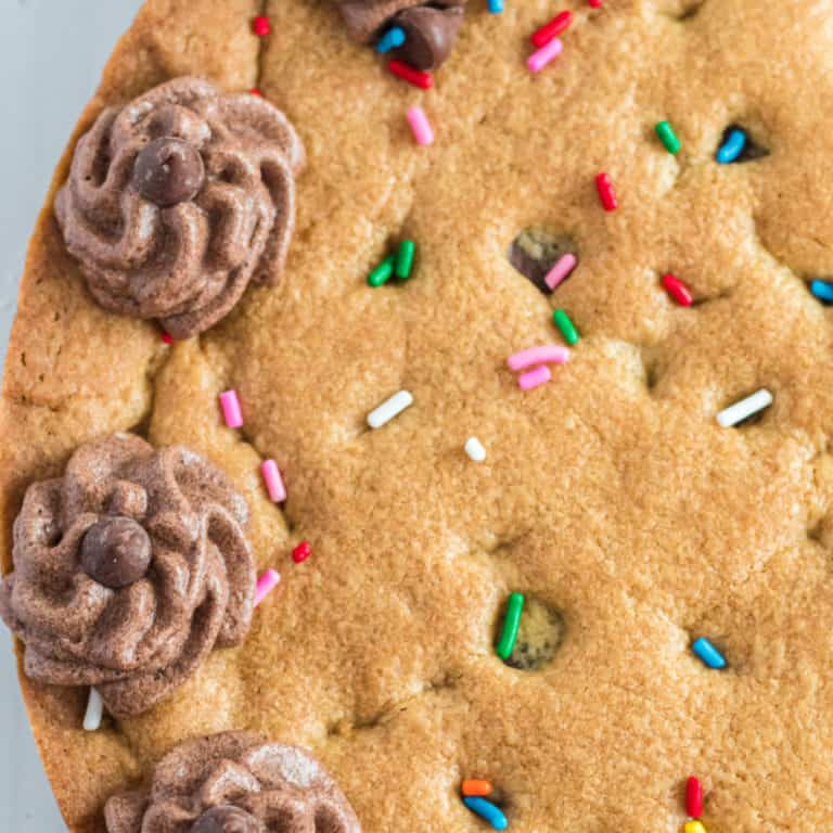 Looking for a fun alternative to a birthday cake? This sweet & chewy Chocolate Chip Cookie Cake is the perfect choice for your next birthday celebration!