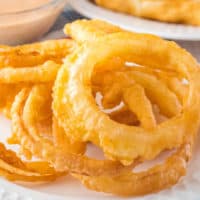 One of my favorite things to serve up alongside hamburgers and hot dogs is a pile of Crispy Onion Rings! Crunchy and sweet, they're delicious dipped in fry sauce!