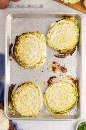 roasted cabbage steaks on a baking sheet
