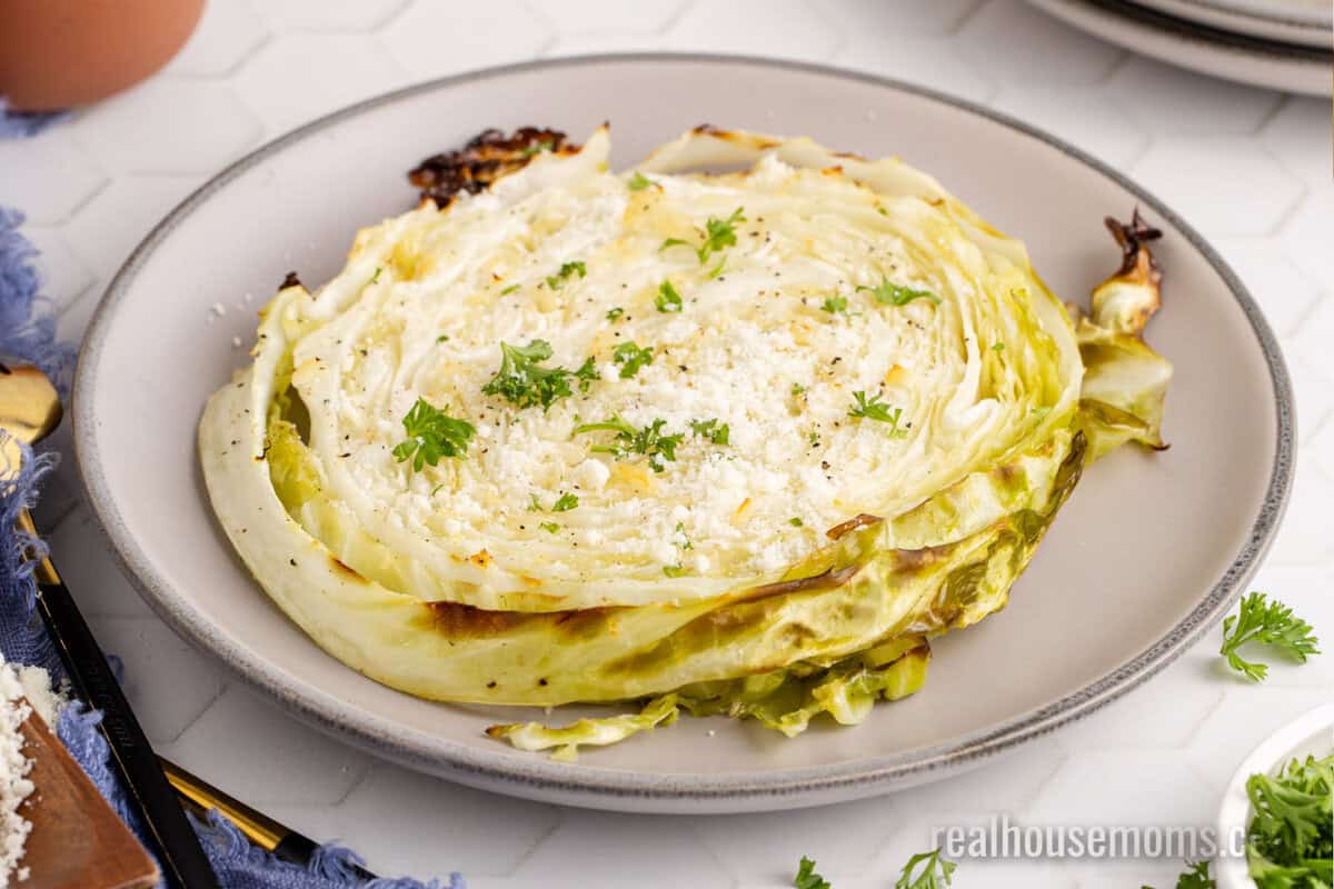 cabbage steak served on a small plate