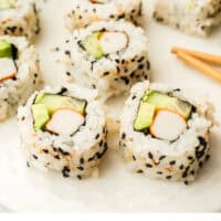 california roll slices on a platter with recipe name at the bottom