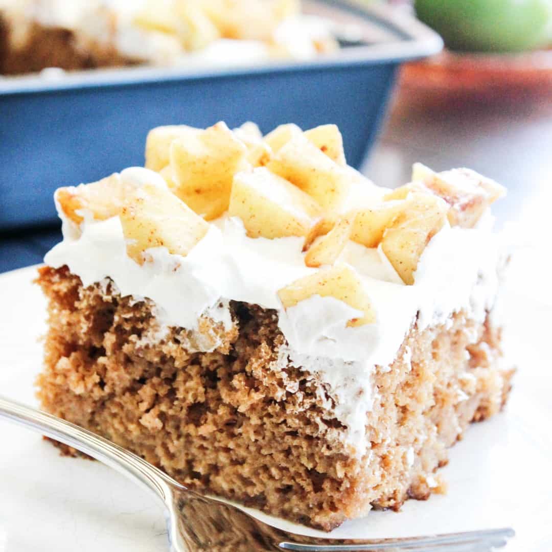 "Fall" in love with this easy spiced CARAMEL APPLE POKE CAKE drizzled with caramel!