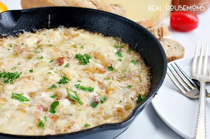 This CARAMELIZED ONION AND BACON SKILLET DIP is an ooey, gooey appetizer no one can resist!