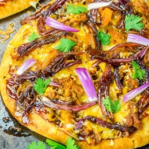 This Caramelized Onion and BBQ Pork Flatbread is a fun and easy weeknight dinner that the whole family will be ranting and raving about!