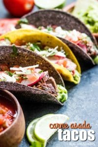 Carne Asada Tacos in hard corn tortilla shells topped with cilantro and radishes