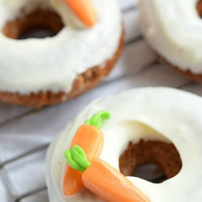 These fluffy BAKED CARROT CAKE DONUTS are glazed with a simple cream cheese frosting for a new twist on a classic Easter dessert!