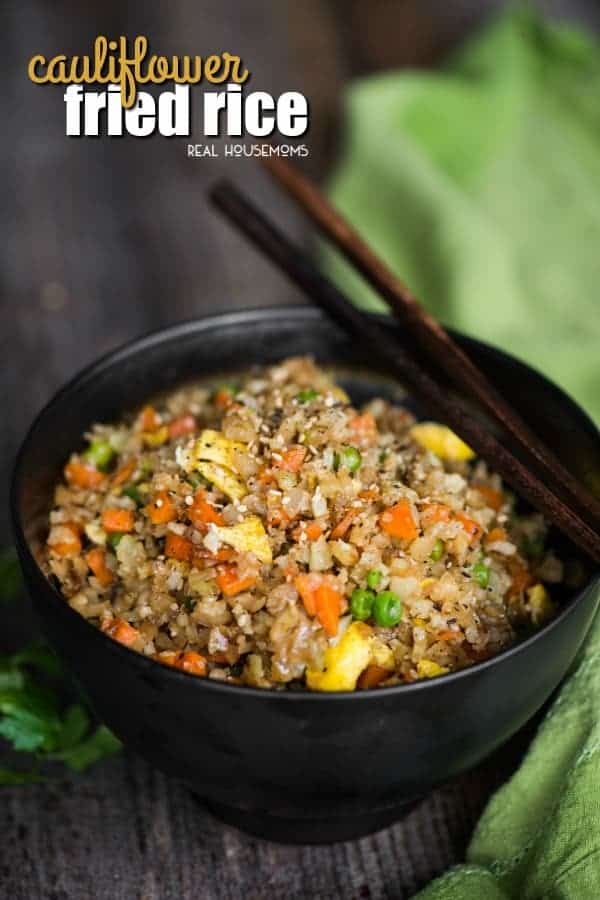 Cauliflower Fried Rice in a serving bowl with chopsticks