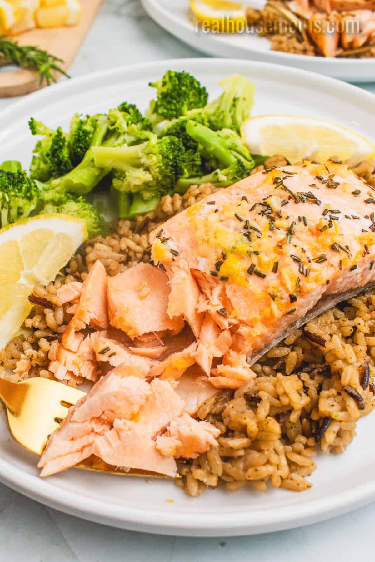 cedar plank salmon flaked with a fork to show the texture