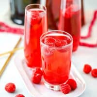 A delicious and beautiful Champagne Cocktail made with juice, liqueur, and fresh fruit. Mix and match your favorite flavors to create your perfect drink!