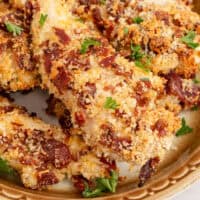 cheddar bacon chicken tenders on a platter with recipe name at the bottom