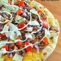 Cheeseburger Pizza is an easy appetizer or meal solution that everyone in the family will love! The only question is… what do you like on your burger?