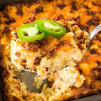 Cheesy Bacon & Jalapeno Hash Brown Casserole is a spicy and rich side dish! It pairs perfectly with comfort food like a ham dinner, pork chops or pot roast!