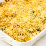 square image of broccoli ham casserole in a dish after baking