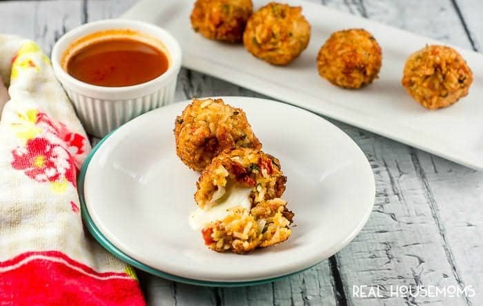 CHEESY MEXICAN RICE BITES make an awesome appetizer for Cinco De Mayo! They are spicy little bites of rice that are crispy on the outside and soft and cheesy on the inside.