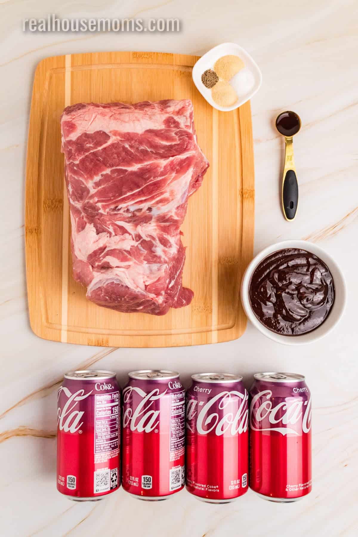 ingredients to make cherry cola pulled pork laid out on a counter and cutting board