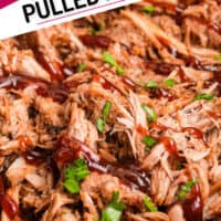 close up image of cherry cola pulled pork topped with a drizzle of bbq sauce and chopped parsley in a slow cooker with the title of the post on the top left corner