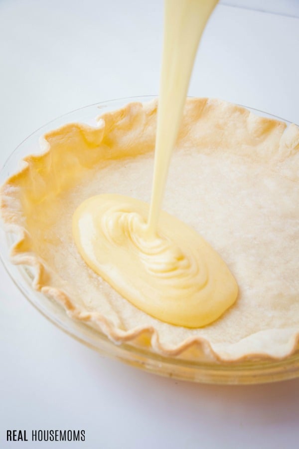 chess pie filling being poured into pie crust